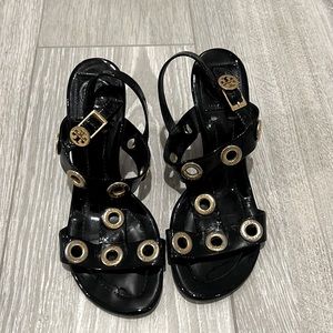 Wedge sandal, elegant sandal is detailed with brass coin by Tory Burch